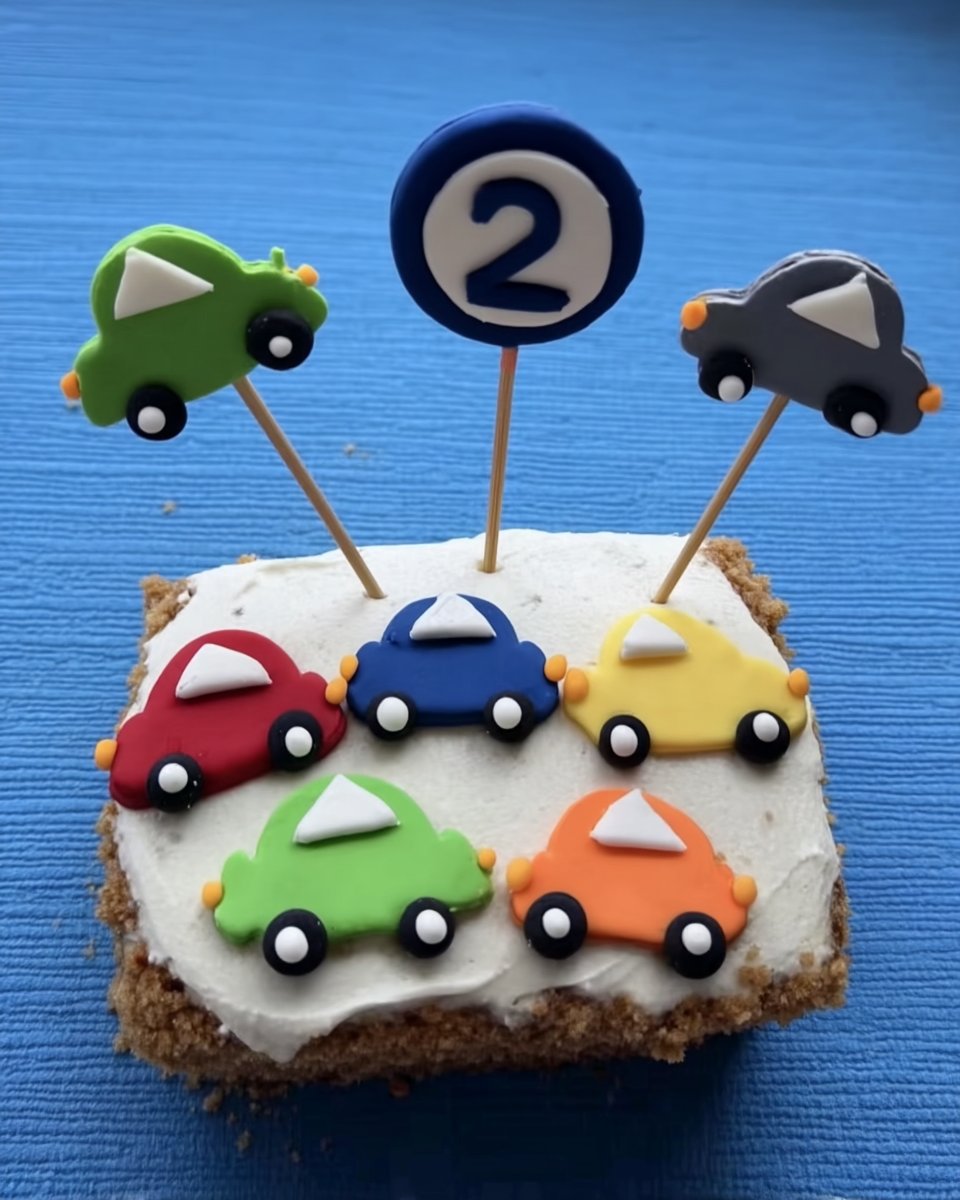 Boy Cake 12 Ingredients for boy cake including flour butter and fondant on a wooden table