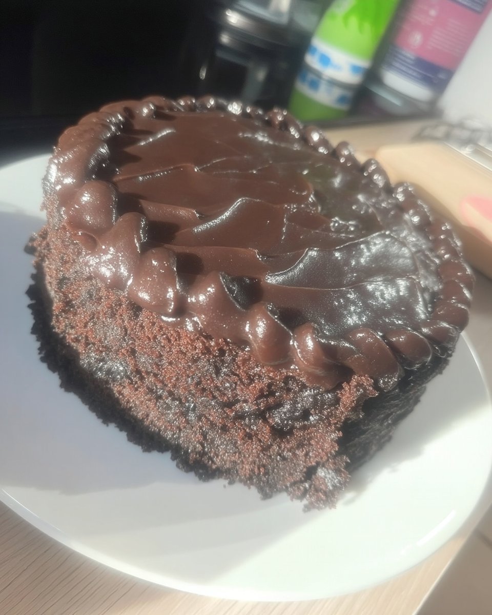 Ingredients for batman cake including flour sugar butter and black gel coloring