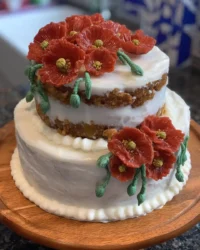 Slice of classic retirement cake with white fondant and buttercream