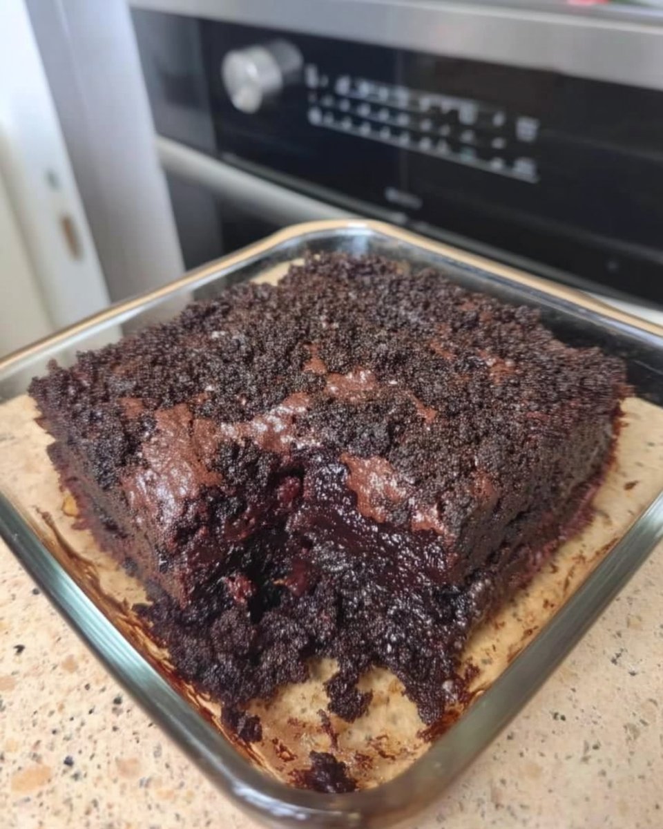 Wacky Cake (Depression Cake) 12 Dry ingredients for wacky cake in a pan with three wells for liquid ingredients