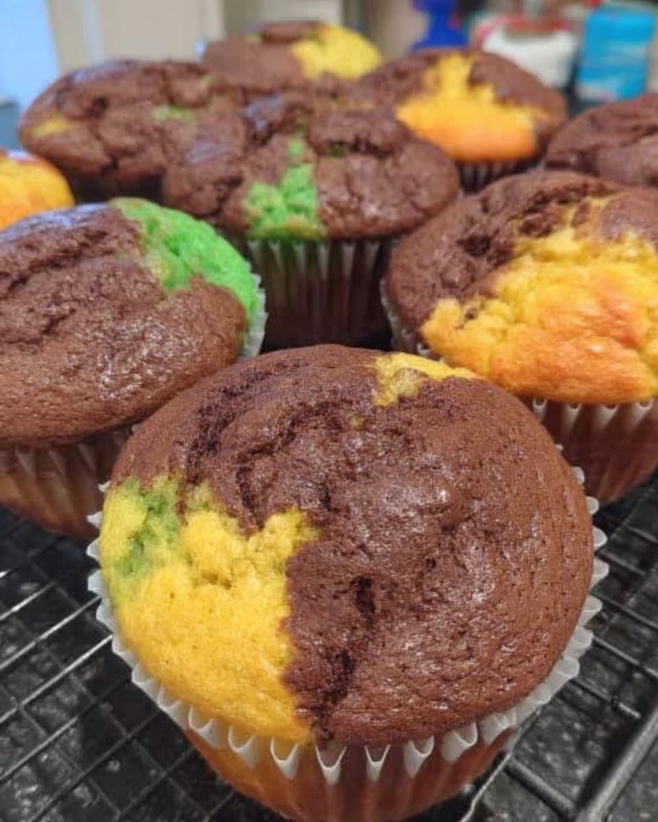Vintage wire cooling rack holding colorful cute cake cupcakes