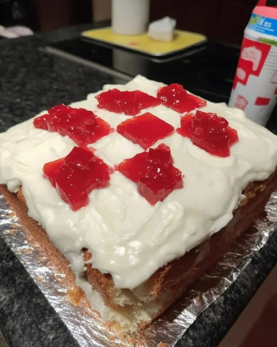 Minecraft Cake 13 Cutting red marzipan into small squares for cake decoration