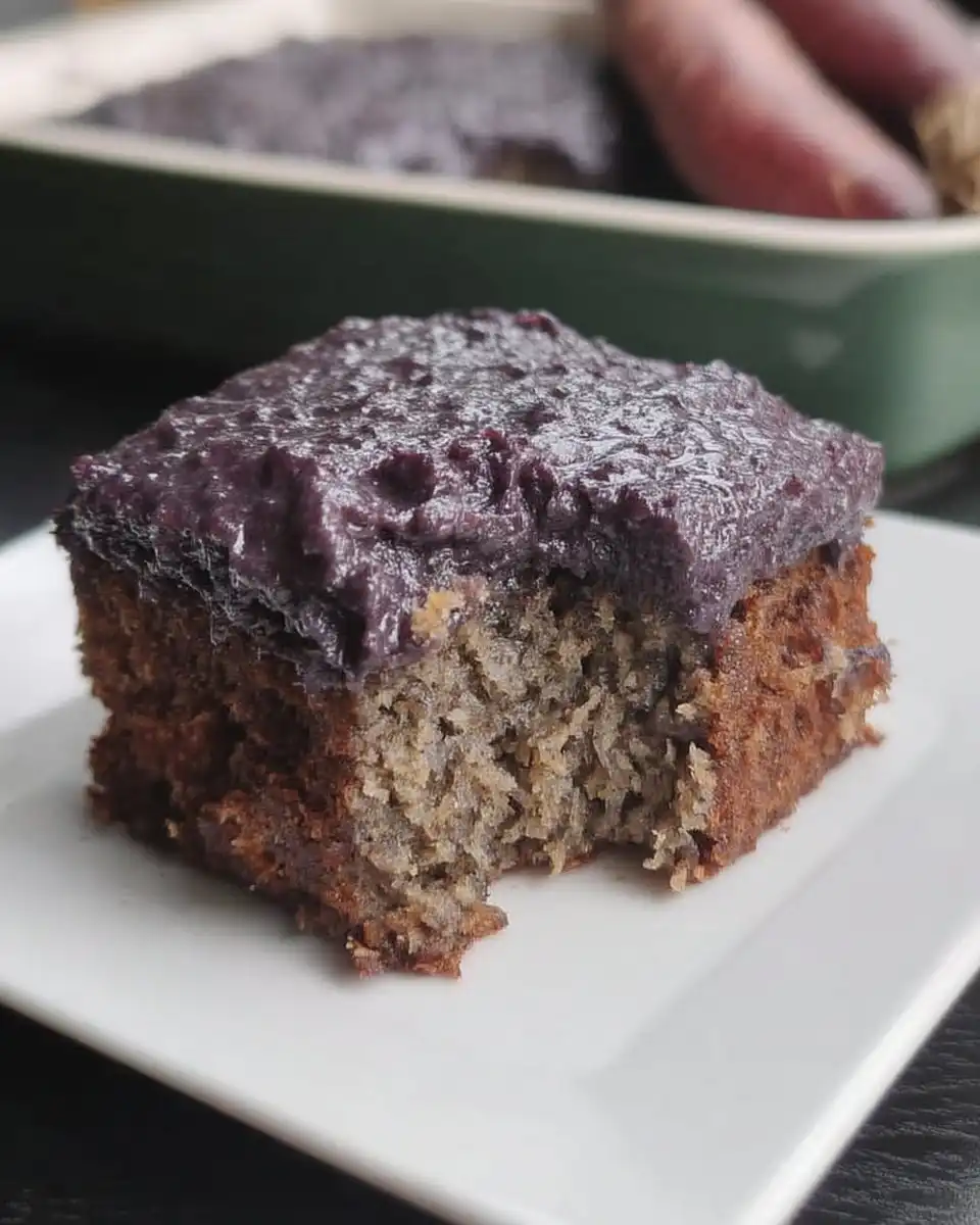 Bowls of grated purple carrots flour and spices on a wooden table