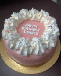 Slice of minimal vanilla cake on a white plate with a fork
