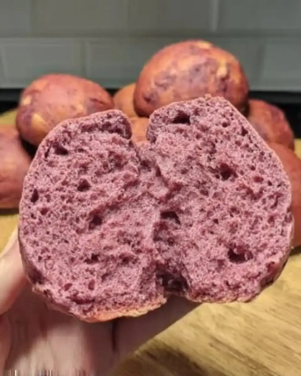 Purple cake batter being mixed in a vintage ceramic bowl