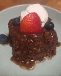 Three layer Nutella cake topped with Kinder Bueno and roasted hazelnuts