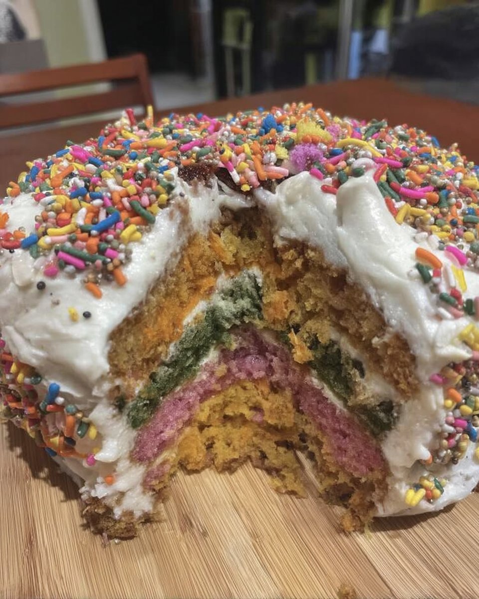 Ingredients for pinata cake including butter sugar eggs and bowl of colorful candy