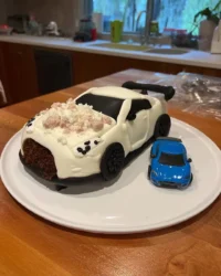 Red car cake with Oreo wheels and fondant details