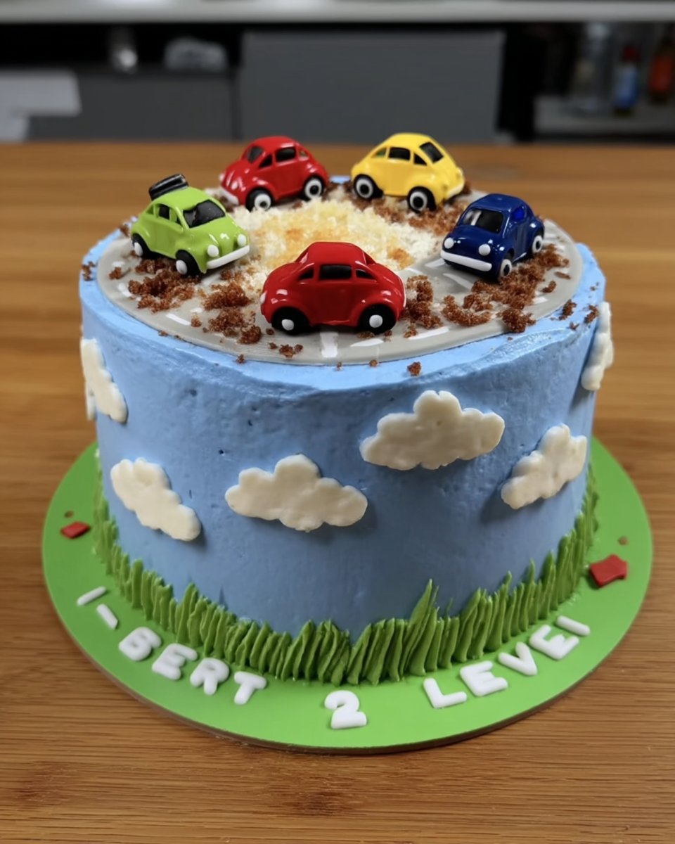 Boy Cake 14 Slice of blue frosted vanilla cake on a vintage party plate