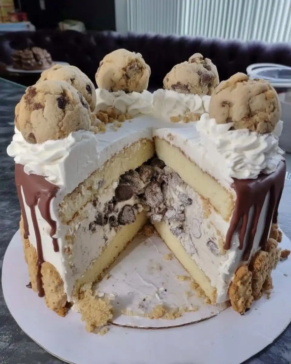 Elegant slice of cookies and cream cake served on a ceramic plate with a fork