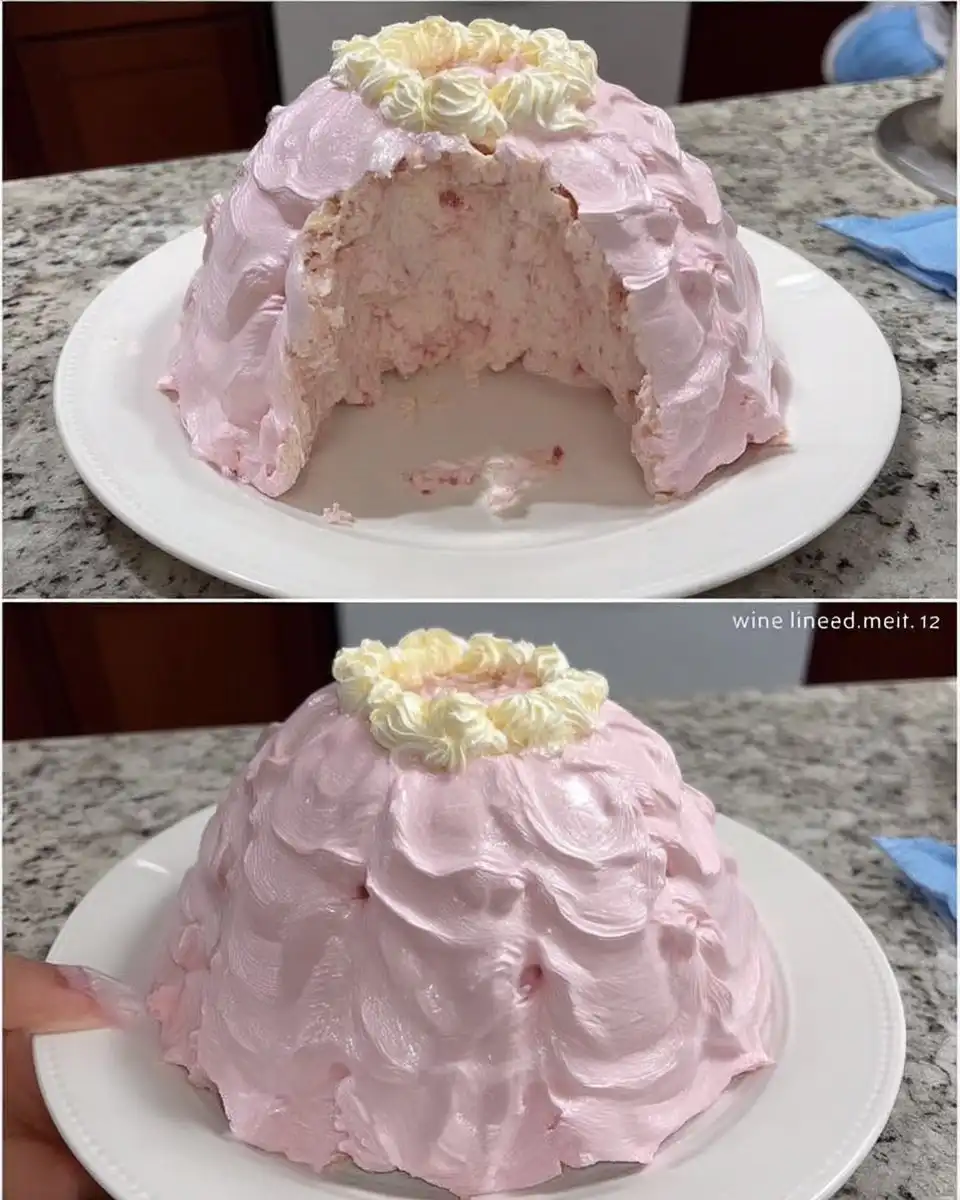 Cross section of doll cake showing sponge layers and cream filling