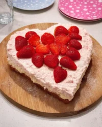 Valentine's heart cake with fresh strawberries and pink frosting