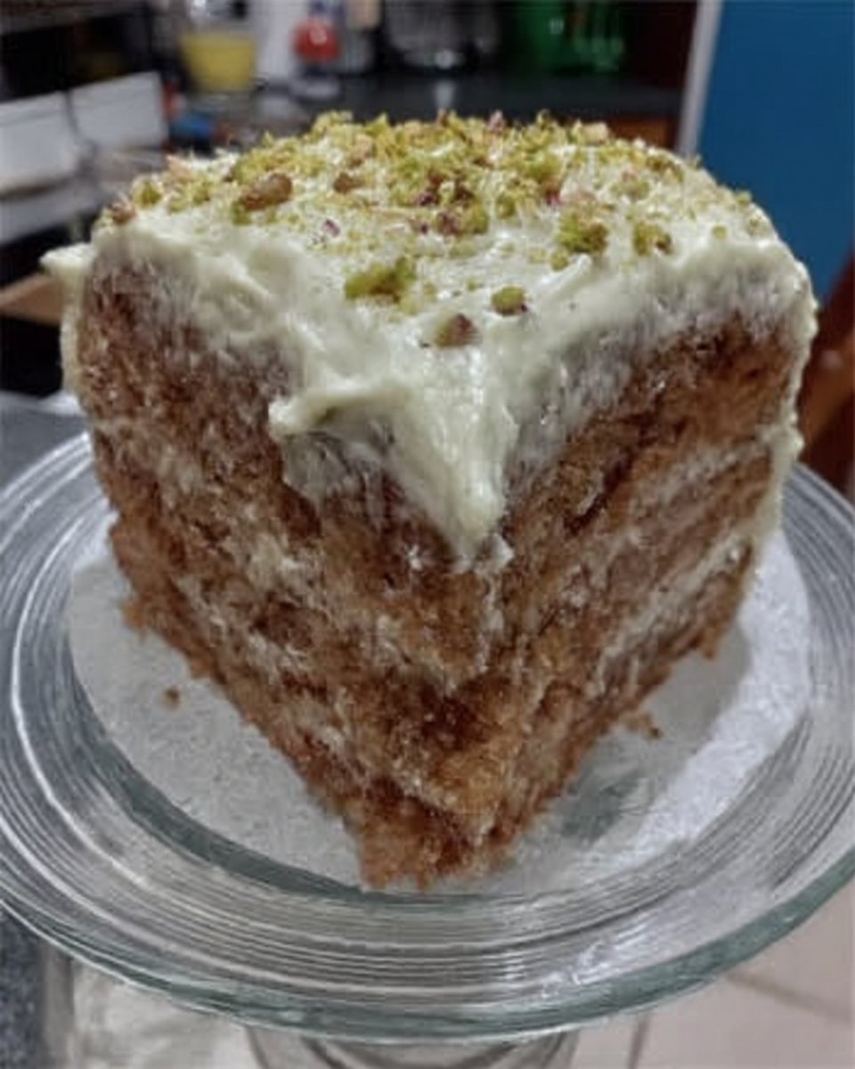 Whole watergate sheet cake in a pan ready for serving