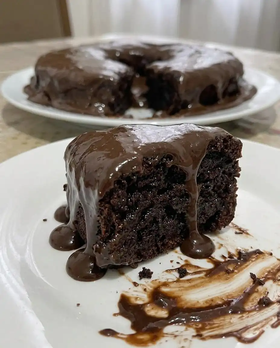 Ingredients for chocolate cake including cocoa powder, flour, and eggs in a professional kitchen setting
