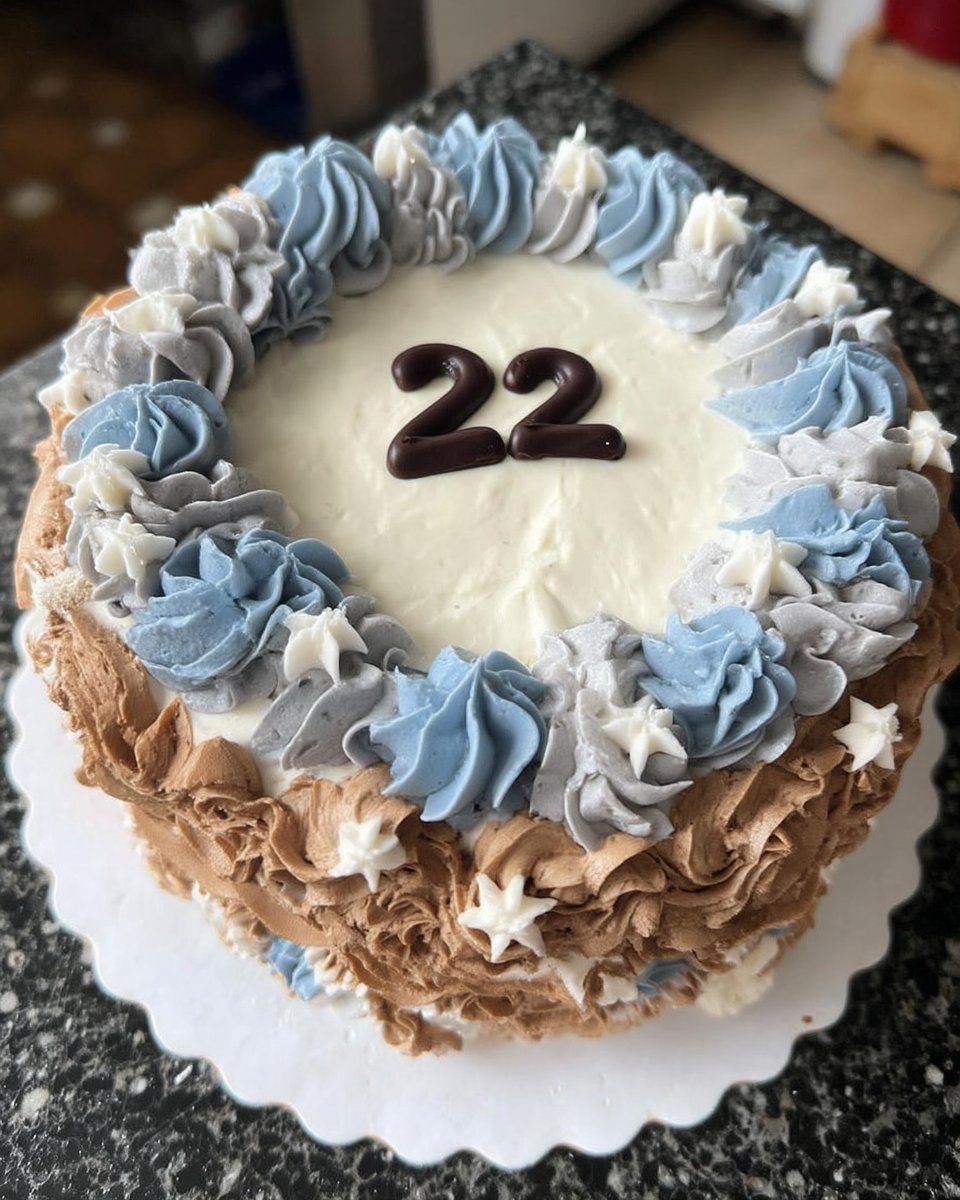 A vertical slice of ombre cake showing a beautiful yellow and blue gradient