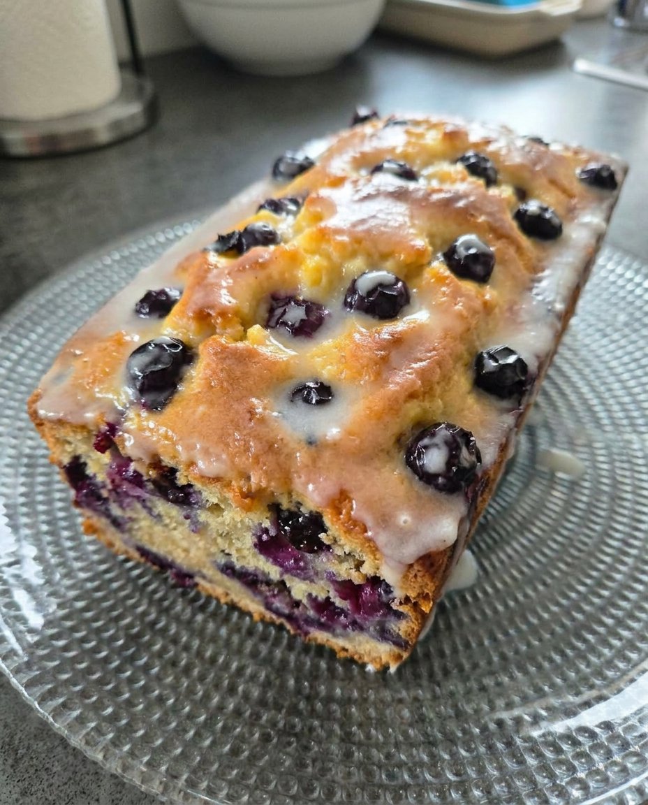 Plump fresh blueberries tossed in flour next to bright yellow lemon zest.