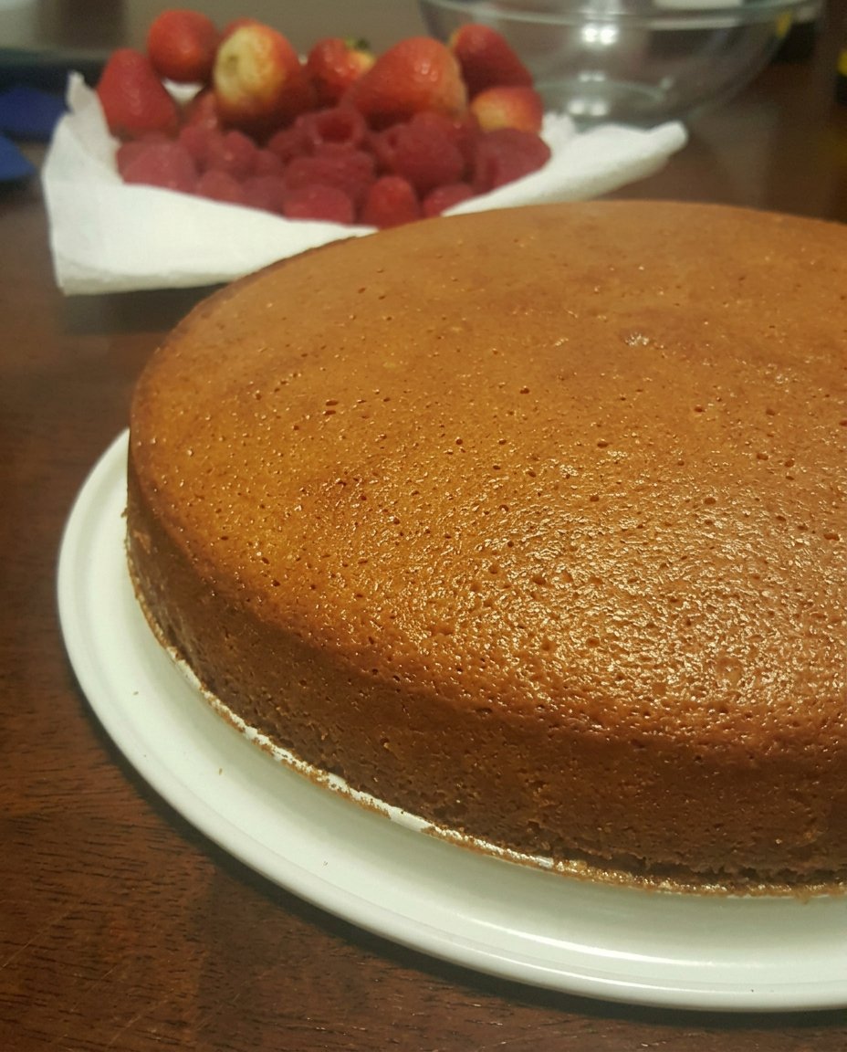 High quality baking ingredients including farm fresh eggs and cake flour on a marble surface