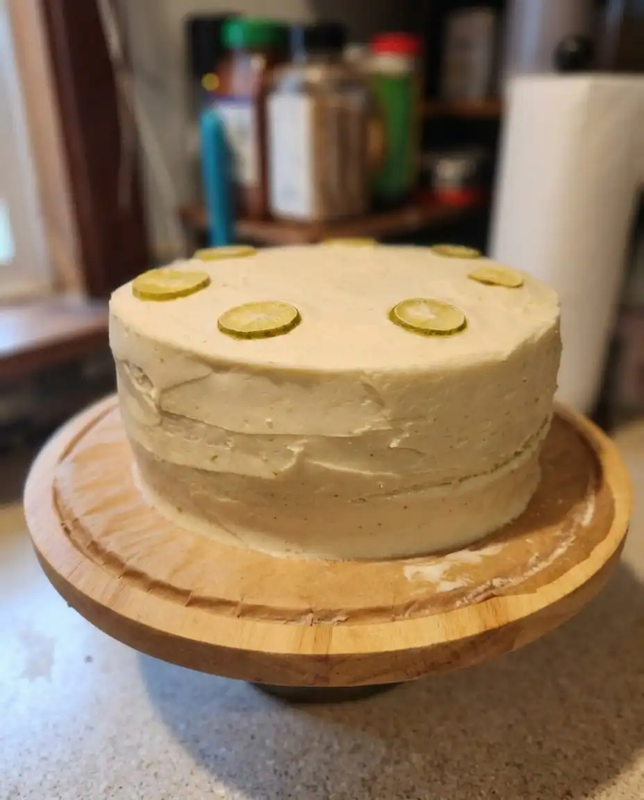 Baking ingredients for key lime cake arranged on a white marble surface