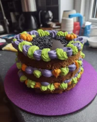 A tall multi-layered Lambeth cake with bright pink orange and yellow ruffles
