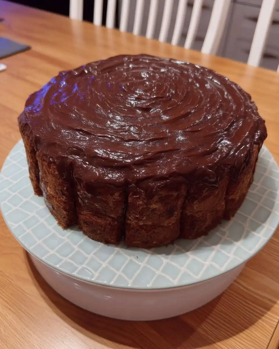 Simple Cake 12 Basic baking ingredients like flour, sugar, eggs, and butter arranged on a wooden table.