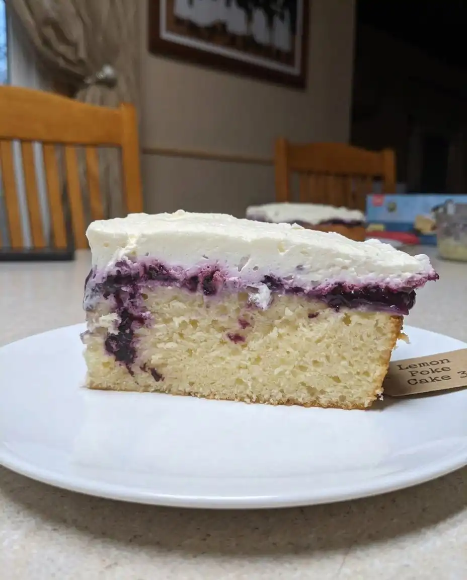 A hand using the handle of a wooden spoon to poke holes in a warm lemon cake