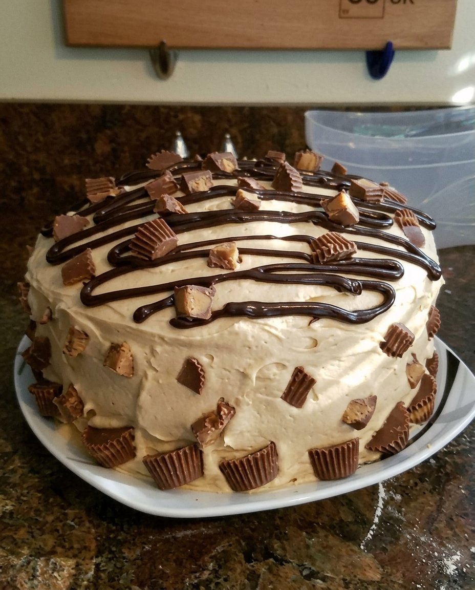 Cake batter being poured into two round ceramic baking pans.