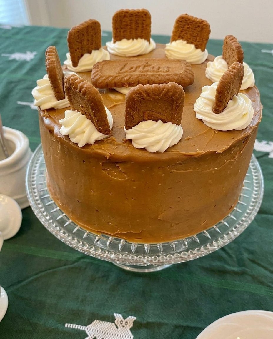 Silky Biscoff buttercream frosting being whipped in a glass bowl