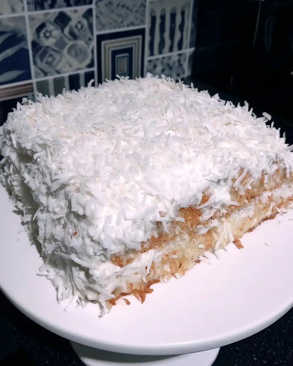 Baking ingredients for coconut cake including cake flour and canned coconut milk