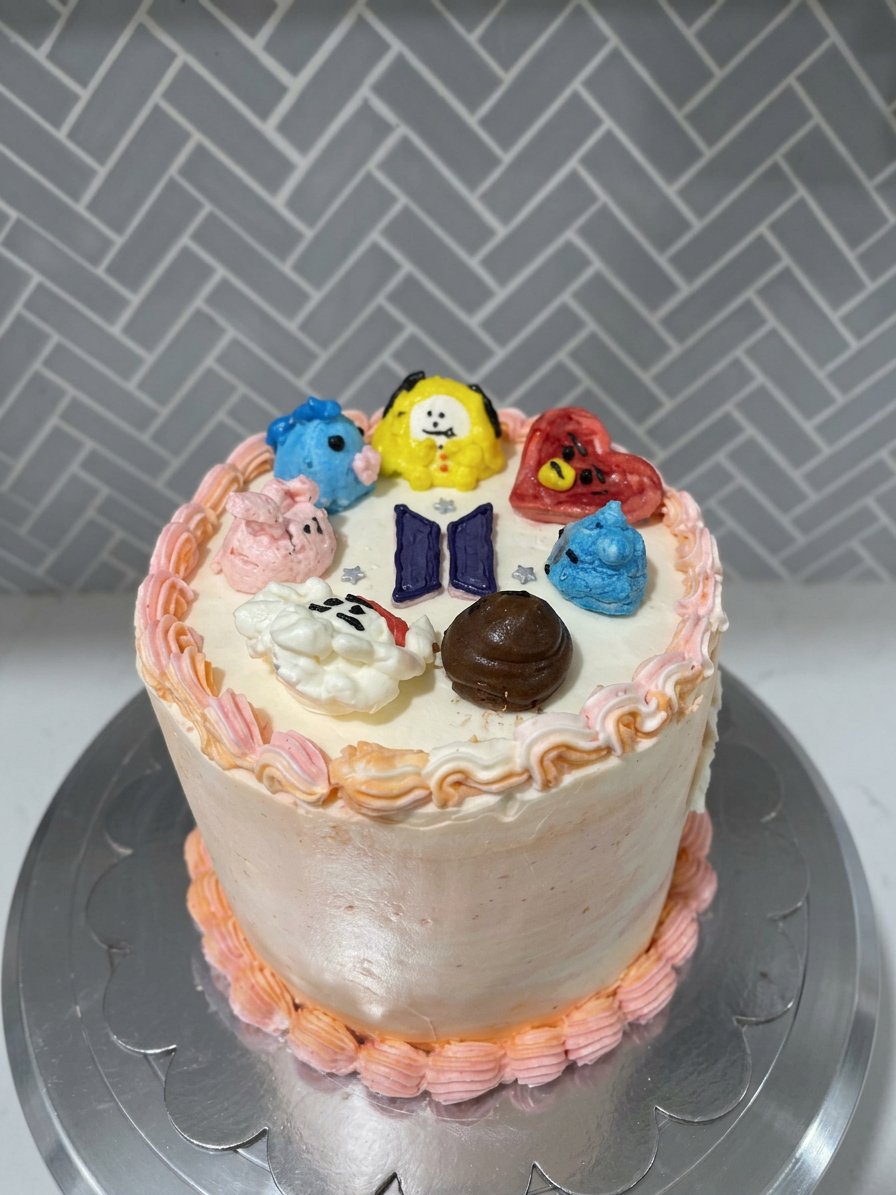 BTS Cake 14 A slice of purple bts cake served on a white plate