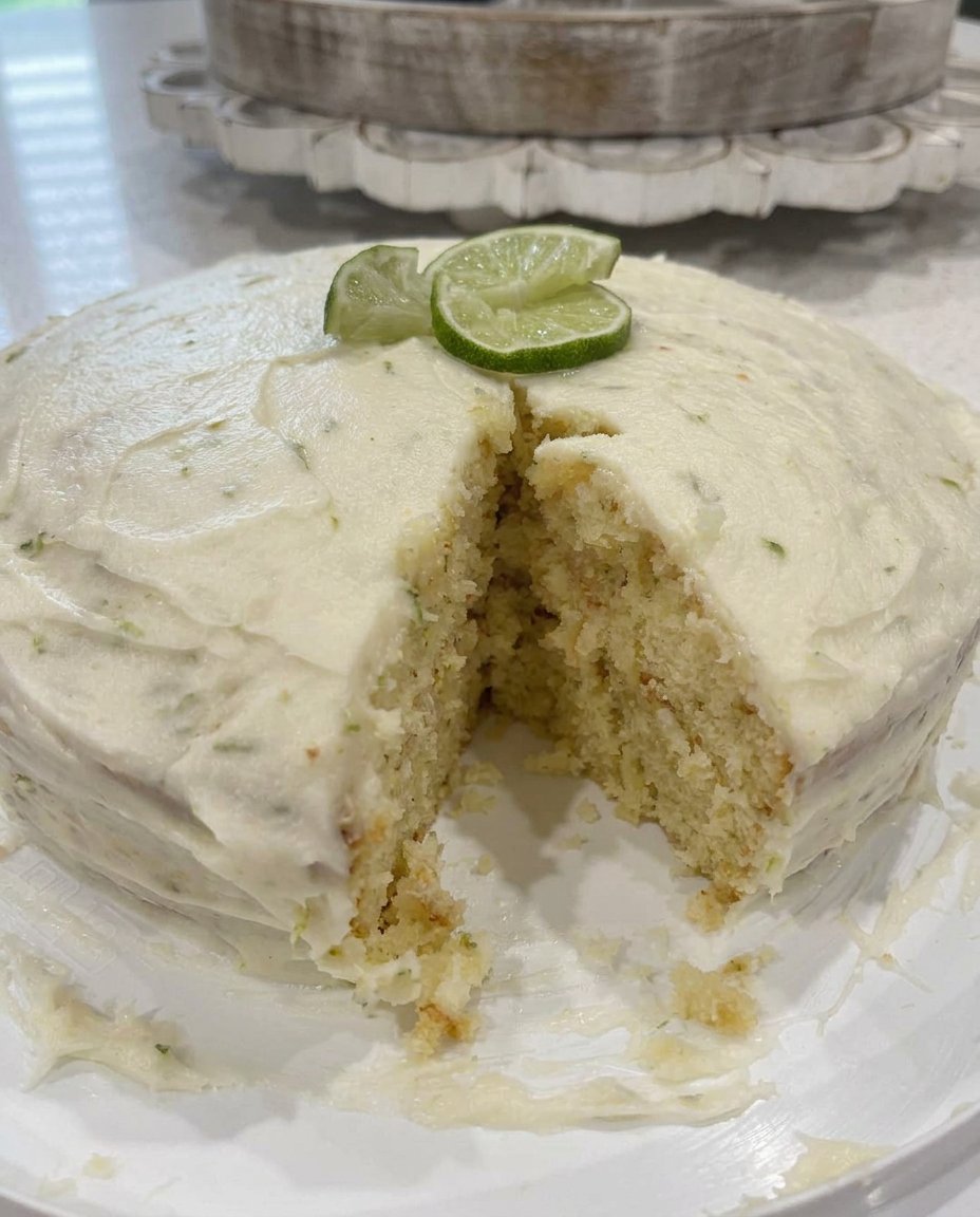 Key Lime Cake 2 14 A single square slice of key lime cake on a fine china plate