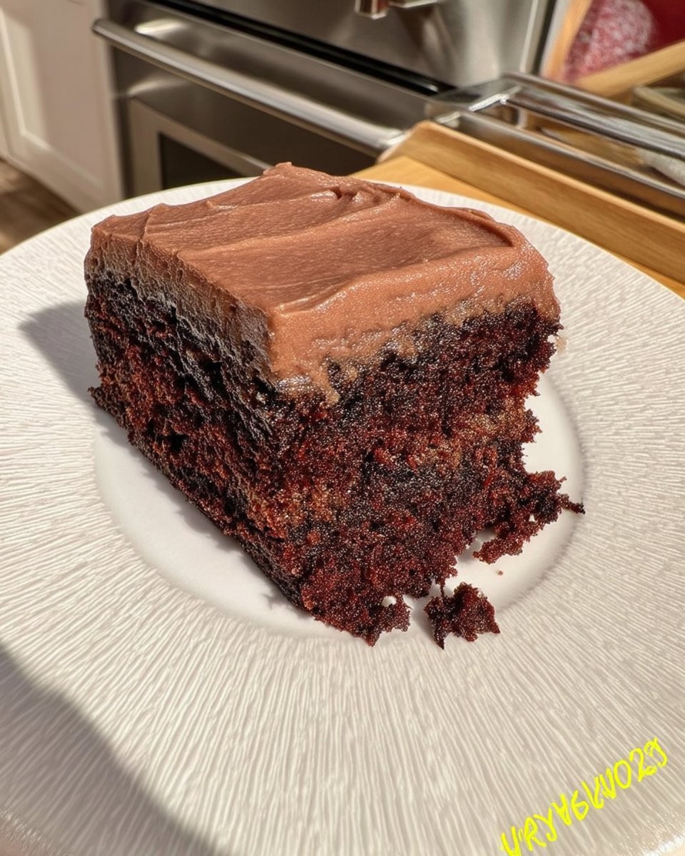 A golden brown simple cake cooling on a vintage wire rack in a sunlit kitchen.