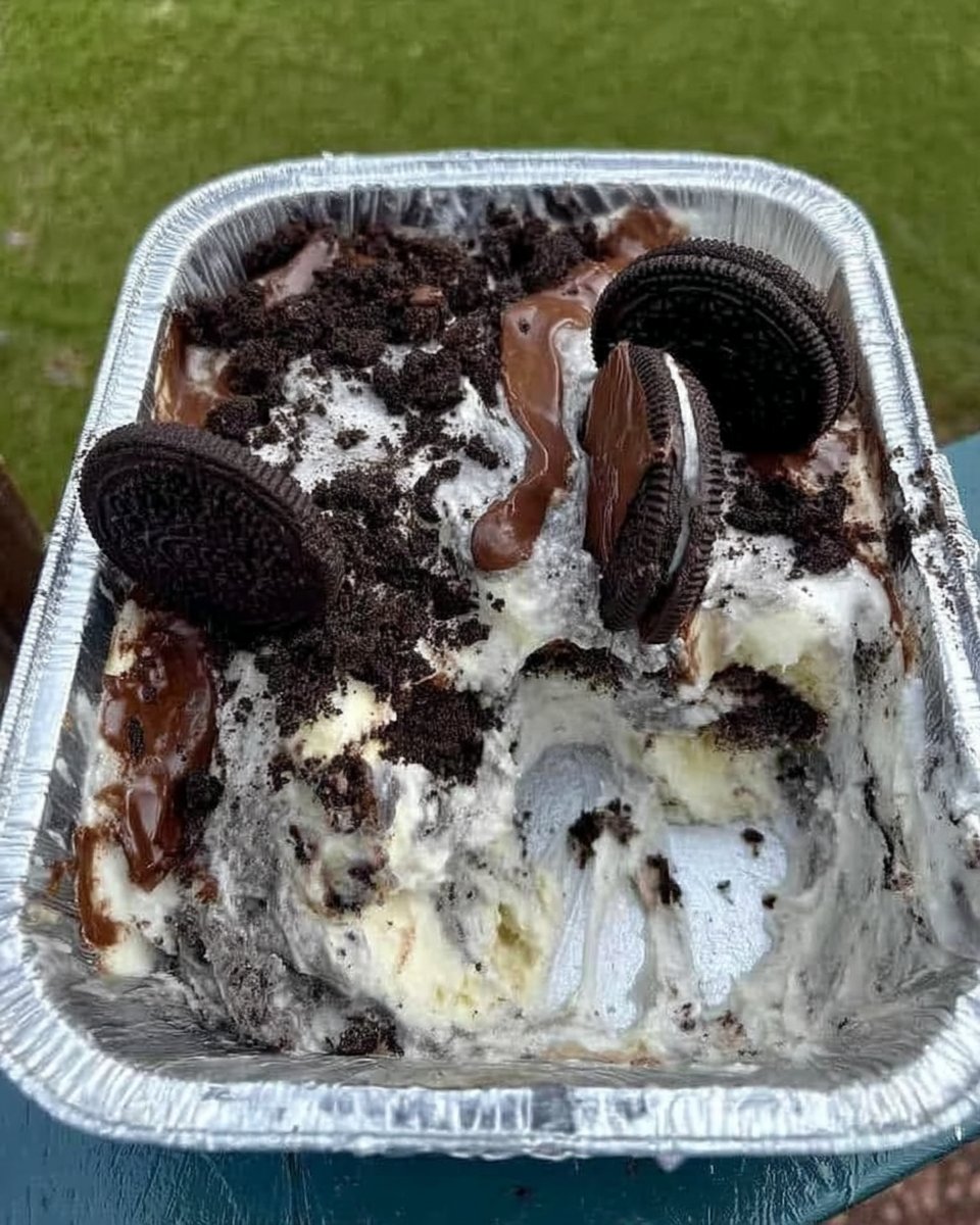 Close up of whipped cream on a whisk showing stiff peaks