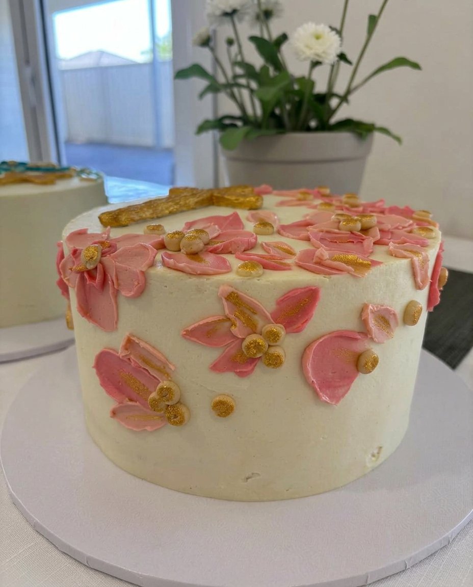 Stiff peaks of whipped egg whites in a metal mixing bowl