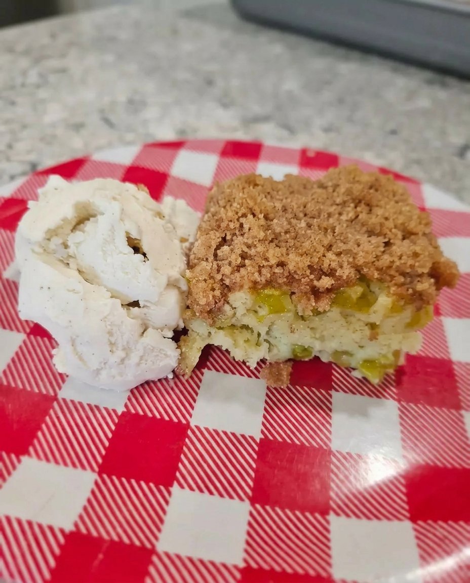 Strawberry Rhubarb Cake 12 Freshly chopped rhubarb stalks and sliced strawberries on a worn wooden cutting board with a dusting of sugar.