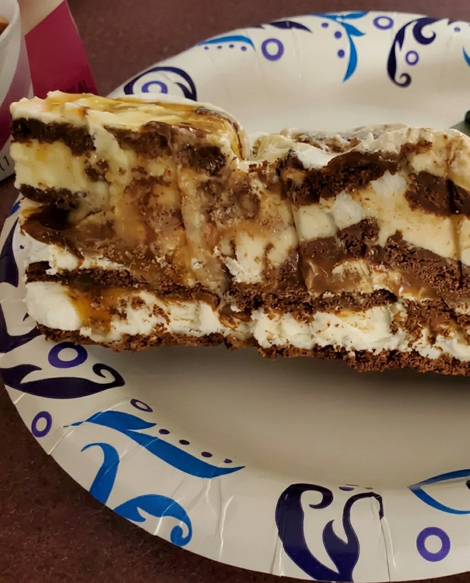 Ingredients for ice cream sandwich cake including m&ms and magic shell