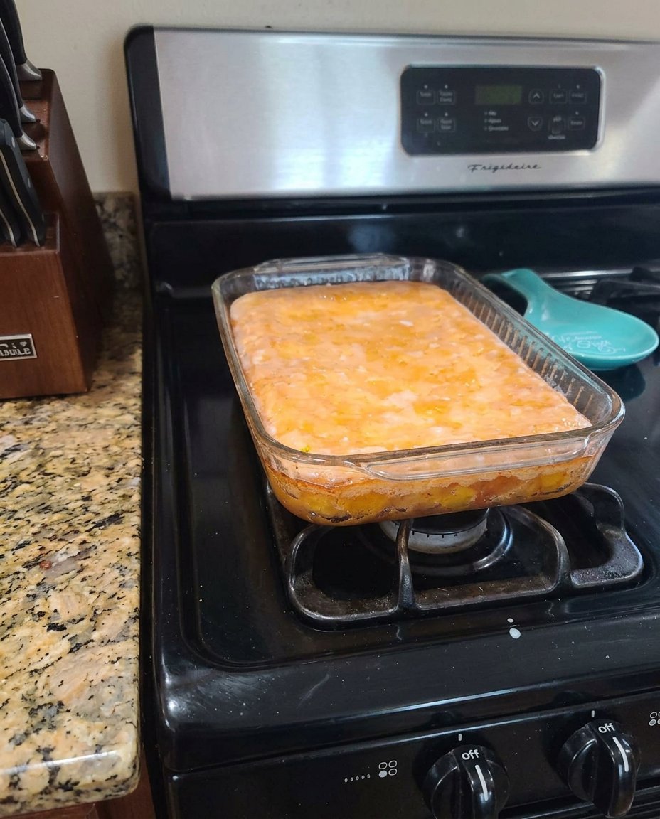 Ingredients for lemon poke cake including cake mix and fresh lemons