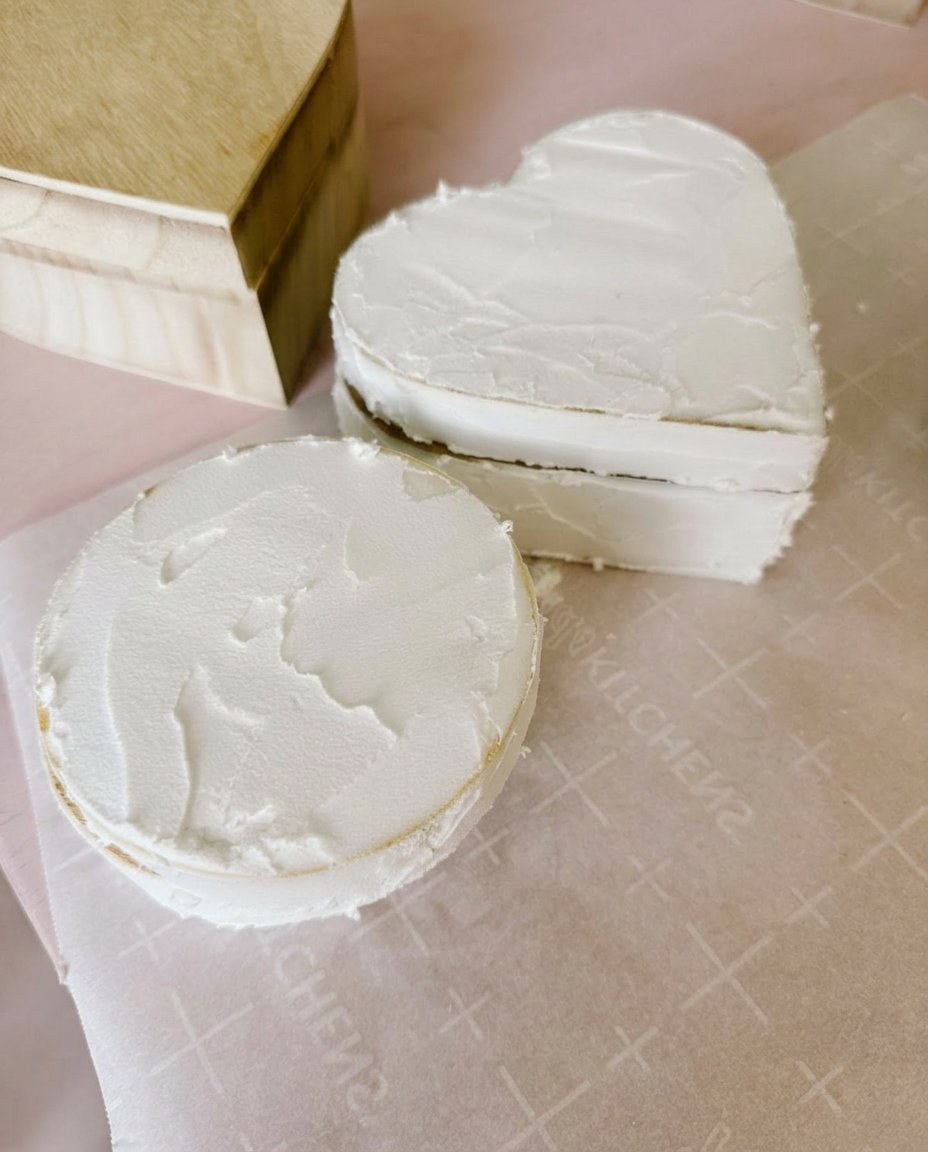 Fake Cake 13 A close up of pink strawberry ganache dripping down the side of a cake