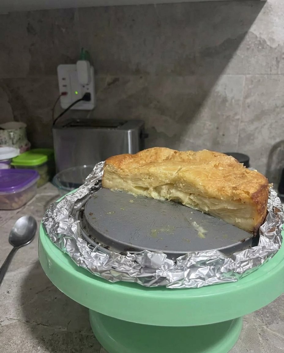 Uniform 8mm cubes of green Granny Smith apples in a white ceramic bowl