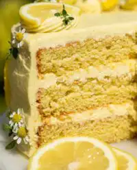Slices of bright lemon chantilly cake with cream cheese frosting
