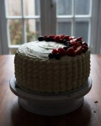 A slice of patriotic berry cake with red and blue fruit filling