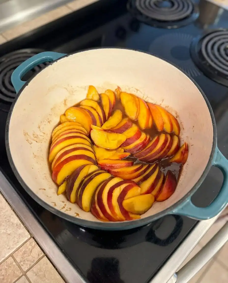 Ingredients for peach upside down cake including fresh peaches, butter, and brown sugar