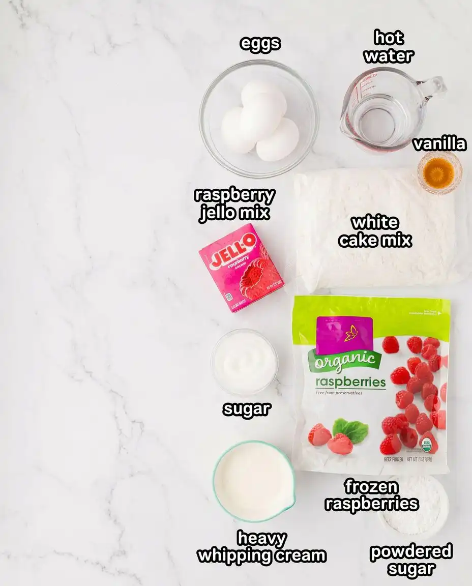 Bowls of cake mix, raspberry gelatin, eggs, and thawed raspberries on a kitchen counter