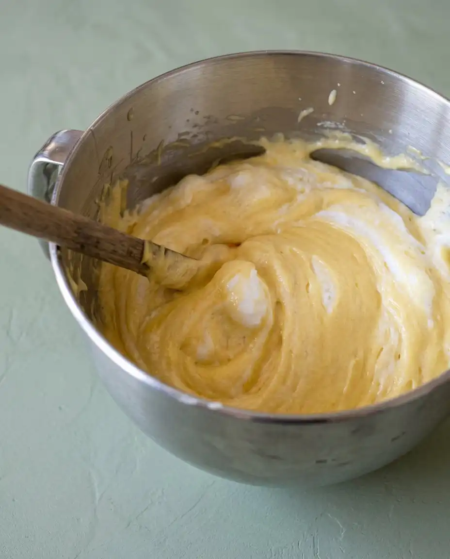 Ingredients for Classic Two-Layer Yellow Cake with Chocolate Frosting arranged neatly.