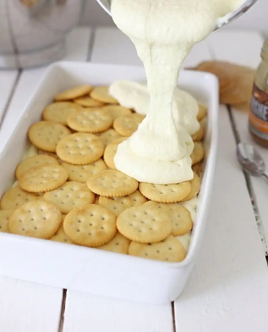 Ingredients for Ritz cracker icebox cake including cream cheese and caramel sauce.