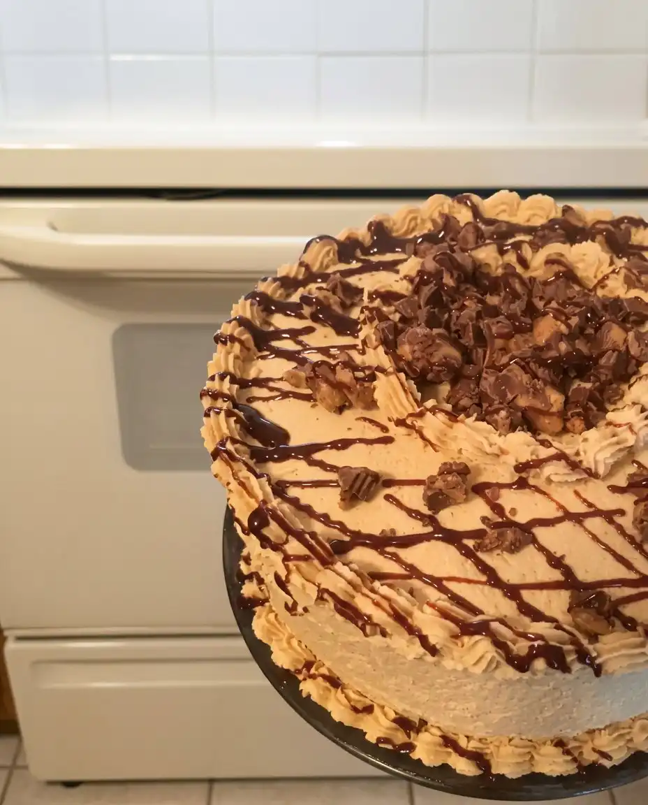 Peanut butter cake served with a cup of coffee and a fork