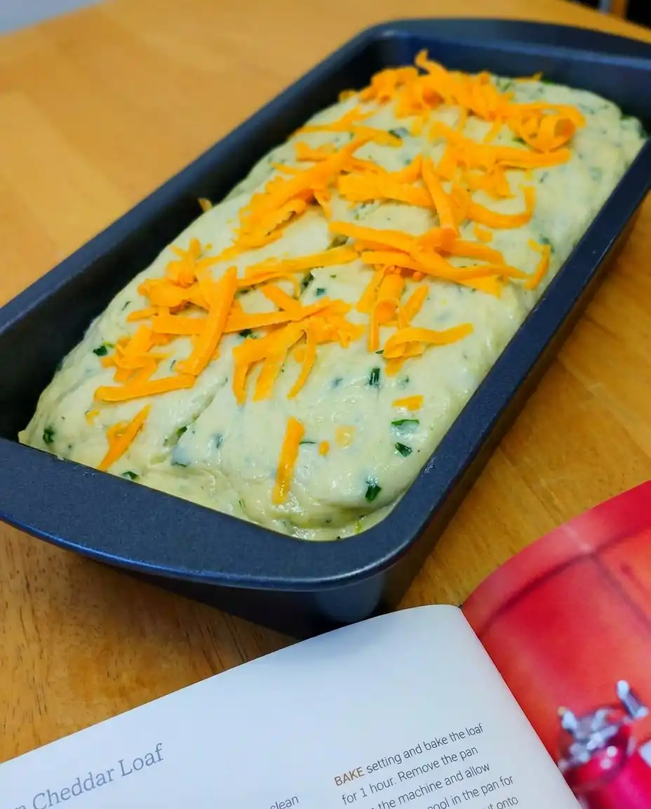 Two slices of savory zucchini bread topped with melting salted butter