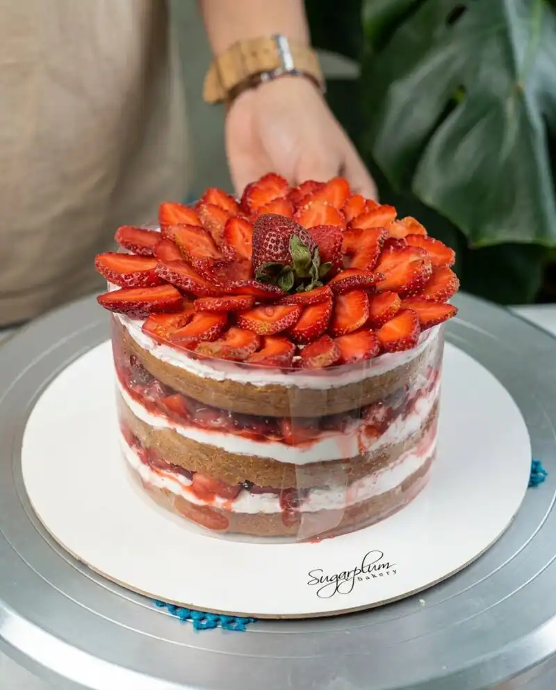 Home - Cake Half - Small Batch Baking & Cupcakes 5 A professional Strawberry Vanilla Cake with white cream layers and fresh berries.