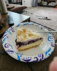 A close up of a no bake lemon blueberry dessert in a vintage glass dish with clear layers of yellow and blue.
