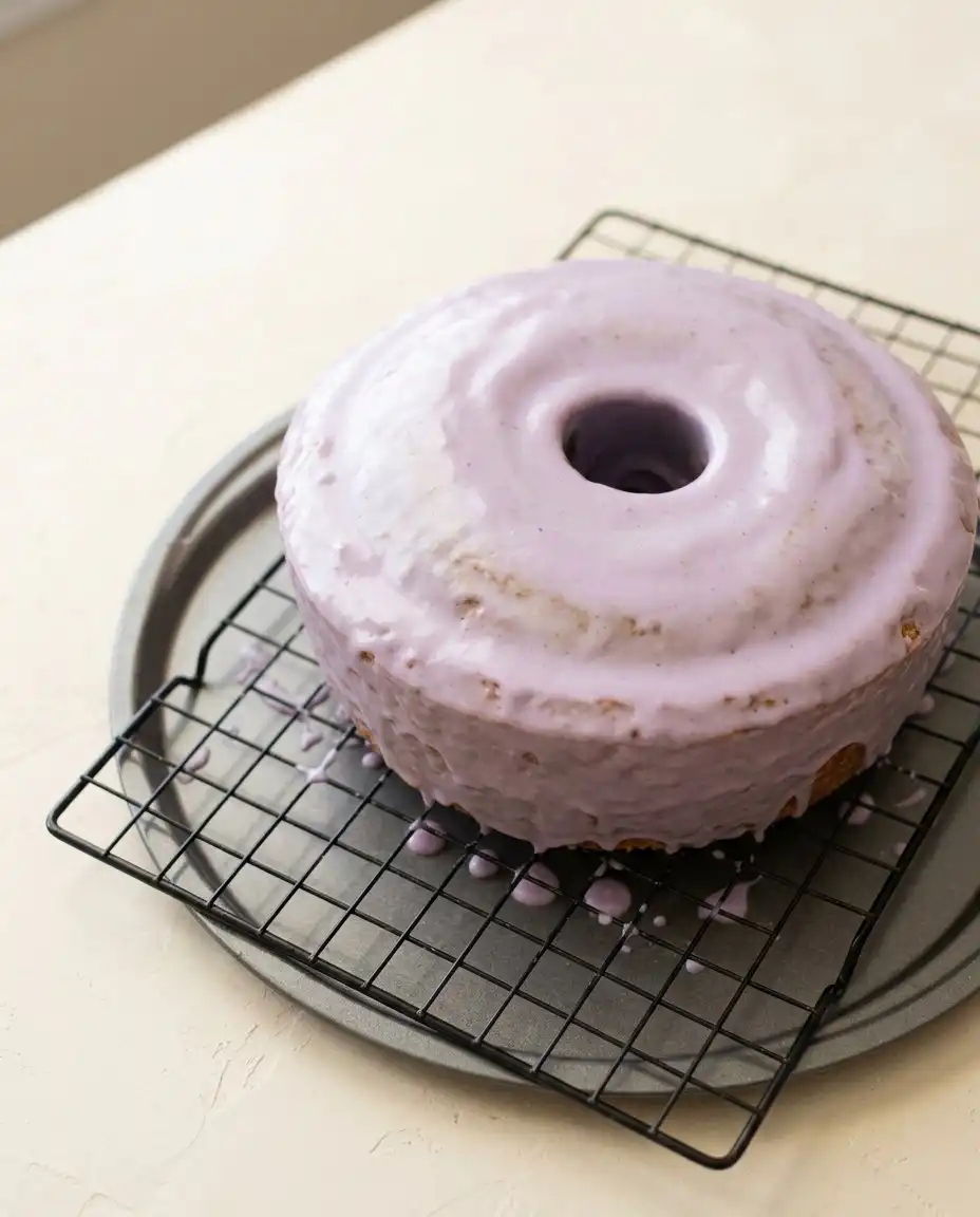 Blackberry Pound Cake 12 A freshly glazed Blackberry Pound Cake sitting on a wire cooling rack