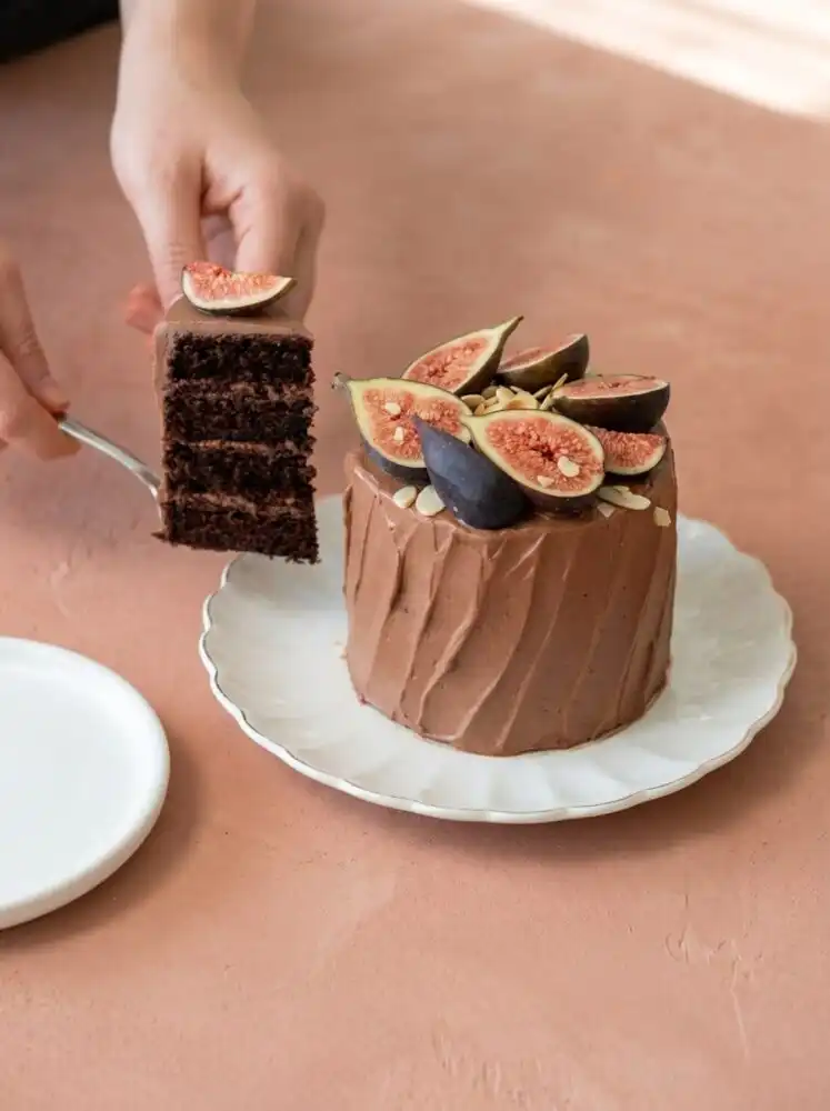 Home - Cake Half - Small Batch Baking & Cupcakes 6 An elegant spread of Mini Chocolate Layer Cakes showing rich layers and chocolate whipped frosting.